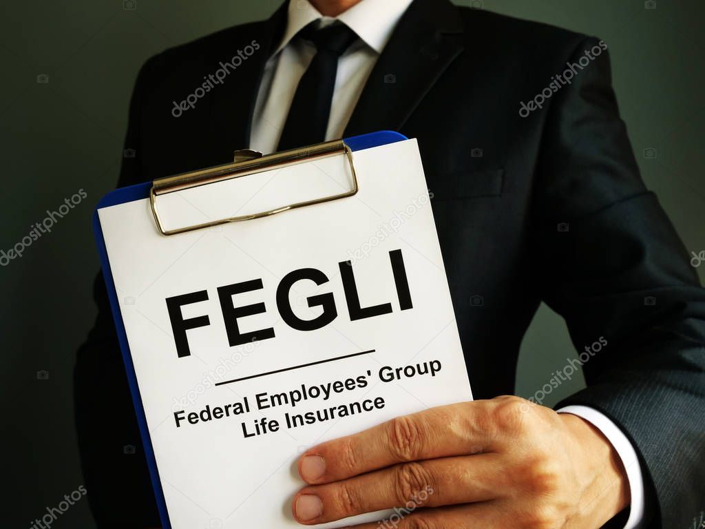 FEGLI Federal Employees Group Life Insurance policy in the hands.