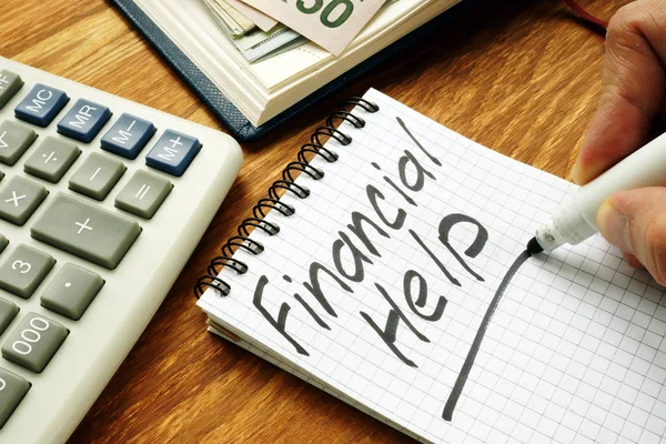 Man is writing financial help sign by marker. — Stock Photo, Image
