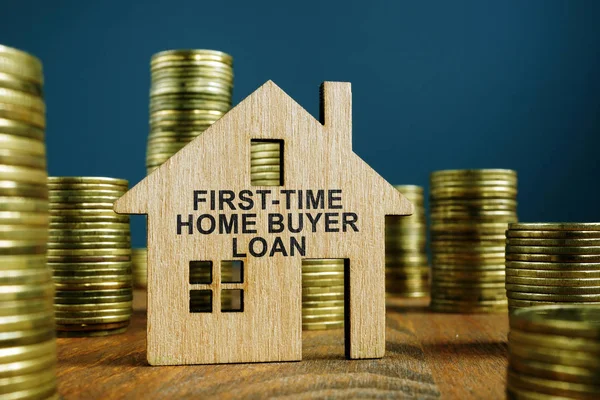 First Time Home Buyer Loan sign on model of house. — Stock Photo, Image