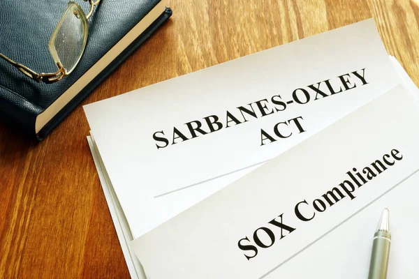 Sarbanes-Oxley Act and SOX compliance policy on table. — Stock Photo, Image
