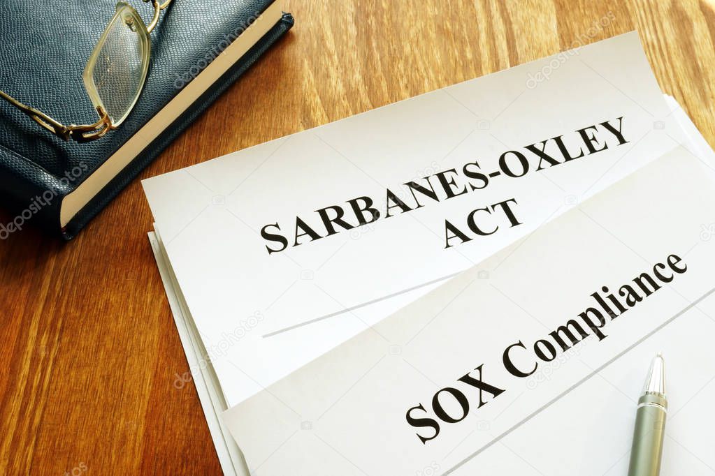 Sarbanes-Oxley Act and SOX compliance policy on table.