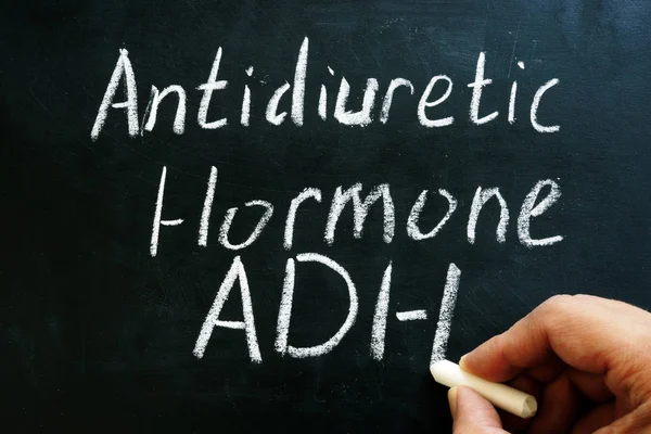 Antidiuretic hormone ADH or vasopressin sign on on the blackboard. — Stock Photo, Image