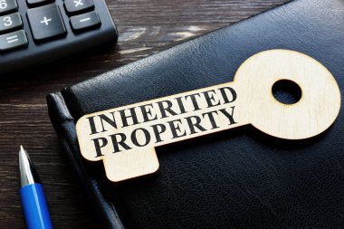 Inherited property phrase on the wooden key. clipart