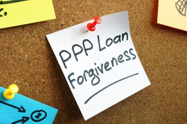 PPP loan forgiveness memo on the board. clipart