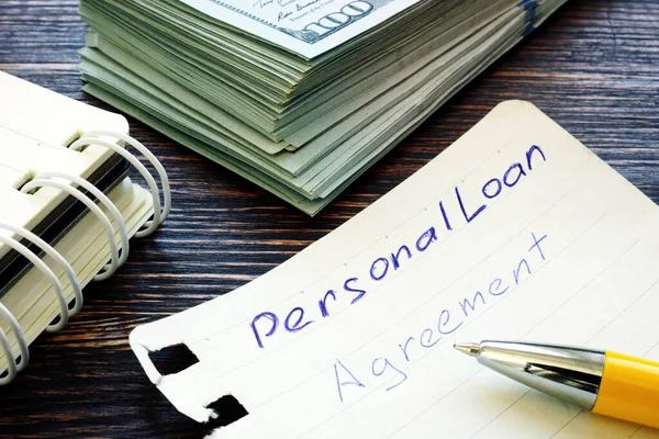 Contrato de empréstimo pessoal escrito à mão na página do bloco de notas . — Fotografia de Stock