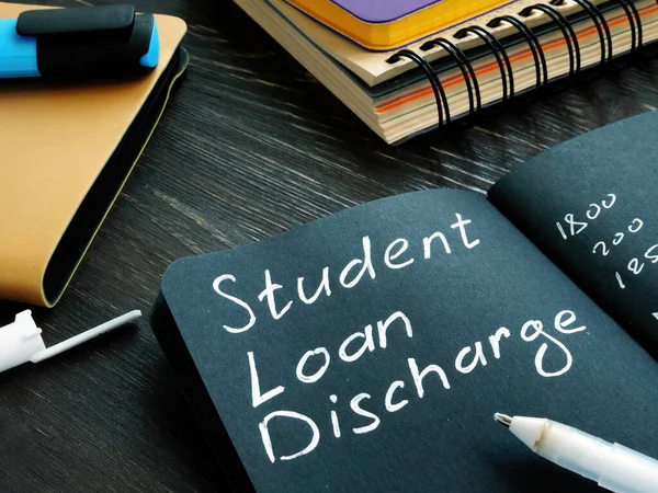 Student loan discharge memo on the black page. — Stock Photo, Image