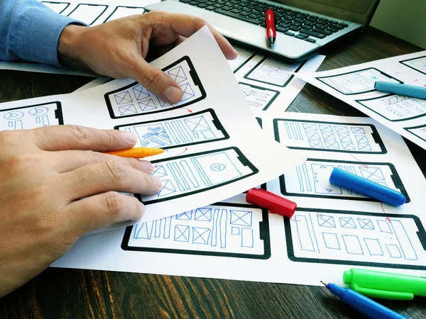 Ux ui designer working with web mobile app sketches. — Stock Photo, Image
