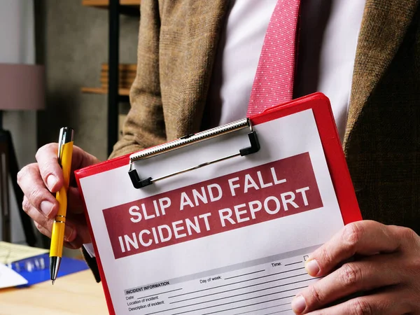 Lawyer offers slip and fall accident report form. — Stock Photo, Image