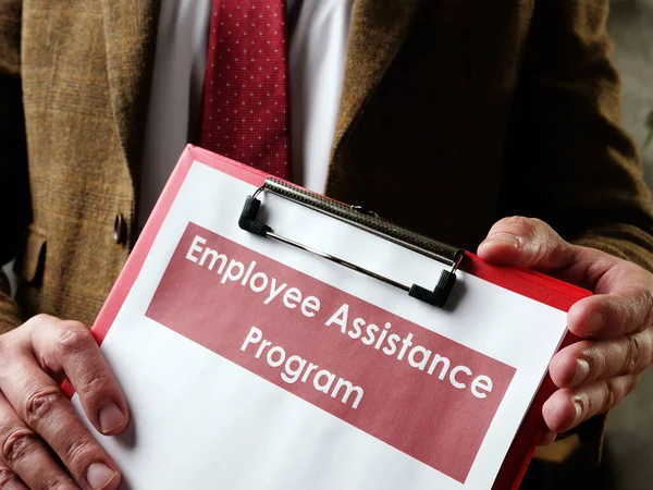 The manager offers Employee Assistance Program EAP papers.