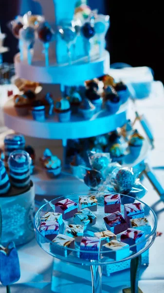 Selection of decorative desserts on buffet table at catered event — Stock Photo, Image