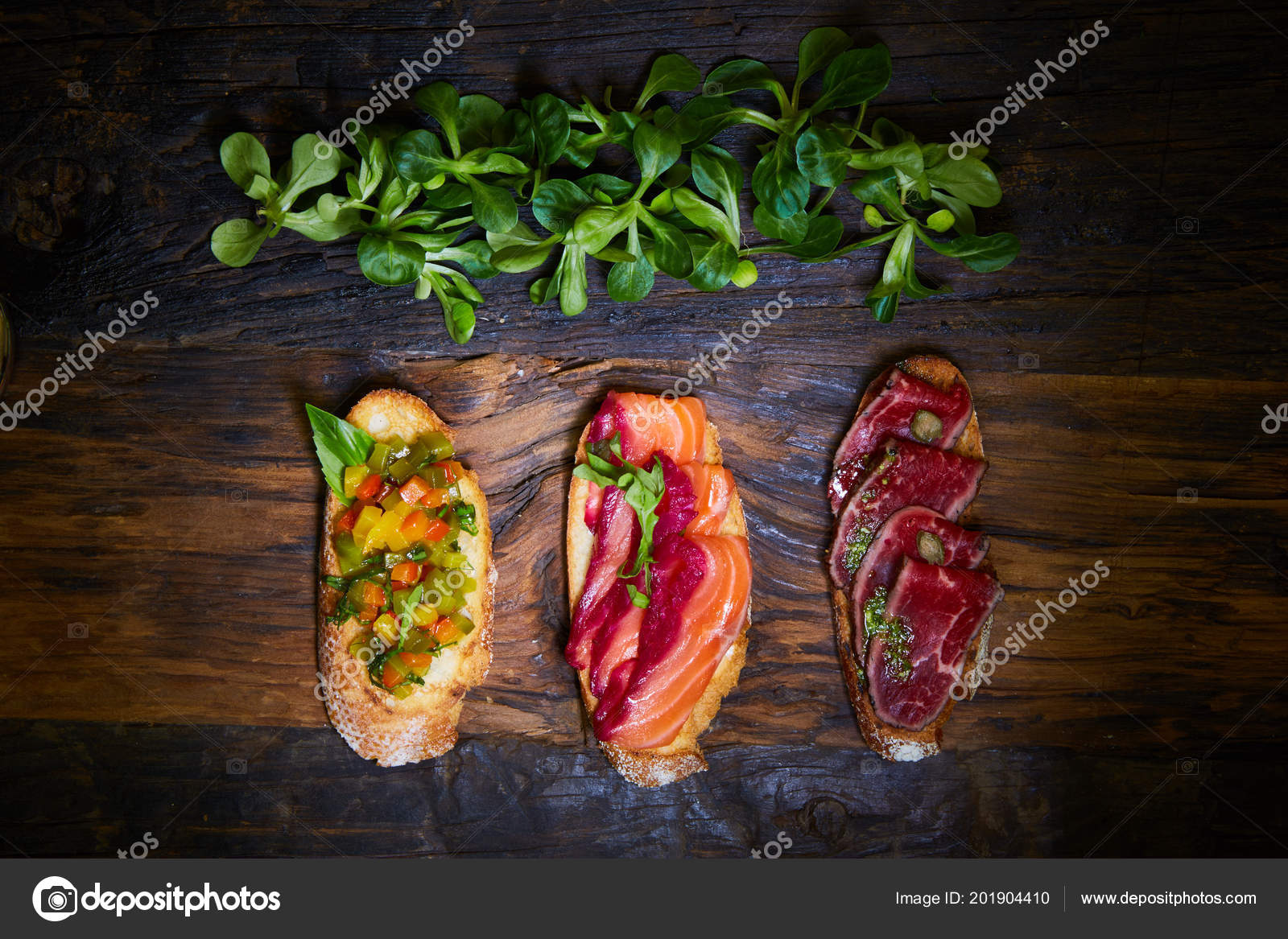 Assorted bruschetta with roast beef, vegetables and lightly salted