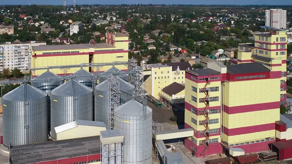 Agricultural Silo. Storage and drying of grains, wheat, corn, soy, against the blue sky with clouds. — Stock Photo, Image