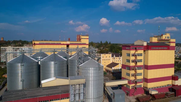 Agricultural Silo. Storage and drying of grains, wheat, corn, soy, against the blue sky with clouds. — Stock Photo, Image