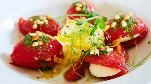 Mozzarella and tomato salad - caprese on the white plate. Shallow dof — Stock Photo, Image