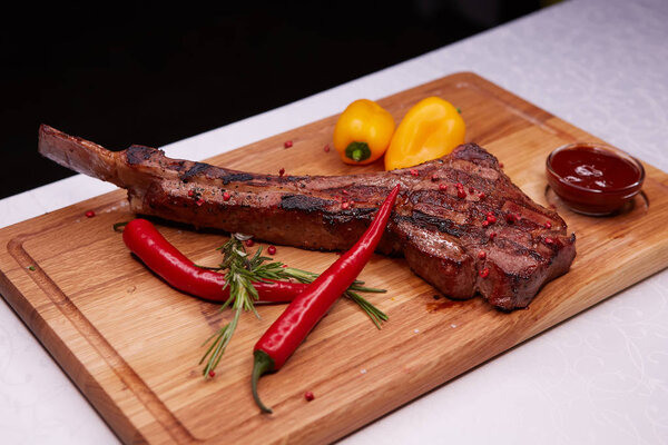 The Barbecue Tomahawk Steak on Cutting Board