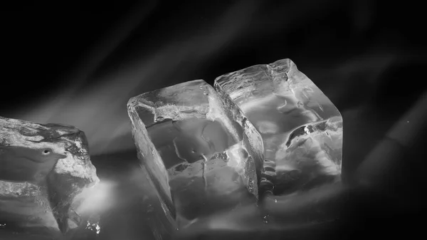 Pieces of crushed ice cubes on black background. — Stock Photo, Image