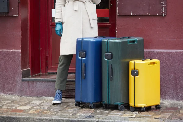 Luggage bag on the city street ready to pick by airport transfer taxi car. — Stock Photo, Image