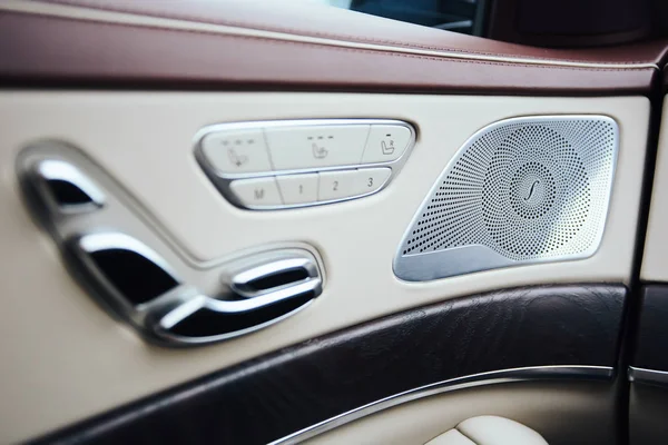 Car inside. Interior of prestige modern car. Climate control, hi-end sound speakers, seat memory, door lever — Stock Photo, Image