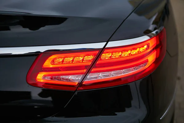 Rear light of red business car. Close up. — Stock Photo, Image