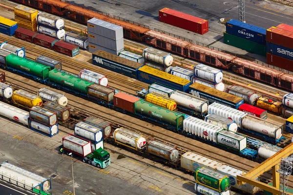 Barcelona, Spain - April 8, 2019: Aerial view on industrial port Mare Combinato Sl. Trucks, load, railway station. — Stock Photo, Image