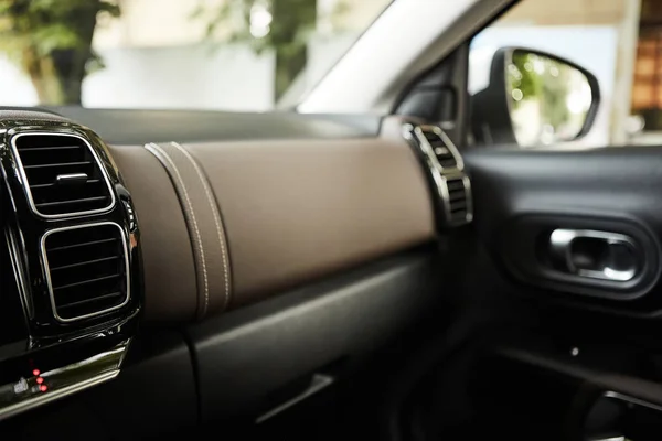 Modern car interior with close-up of ventilation system holes and air conditioning. Concept wallpaper for auto air conditioning and dashboard. — Stock Photo, Image