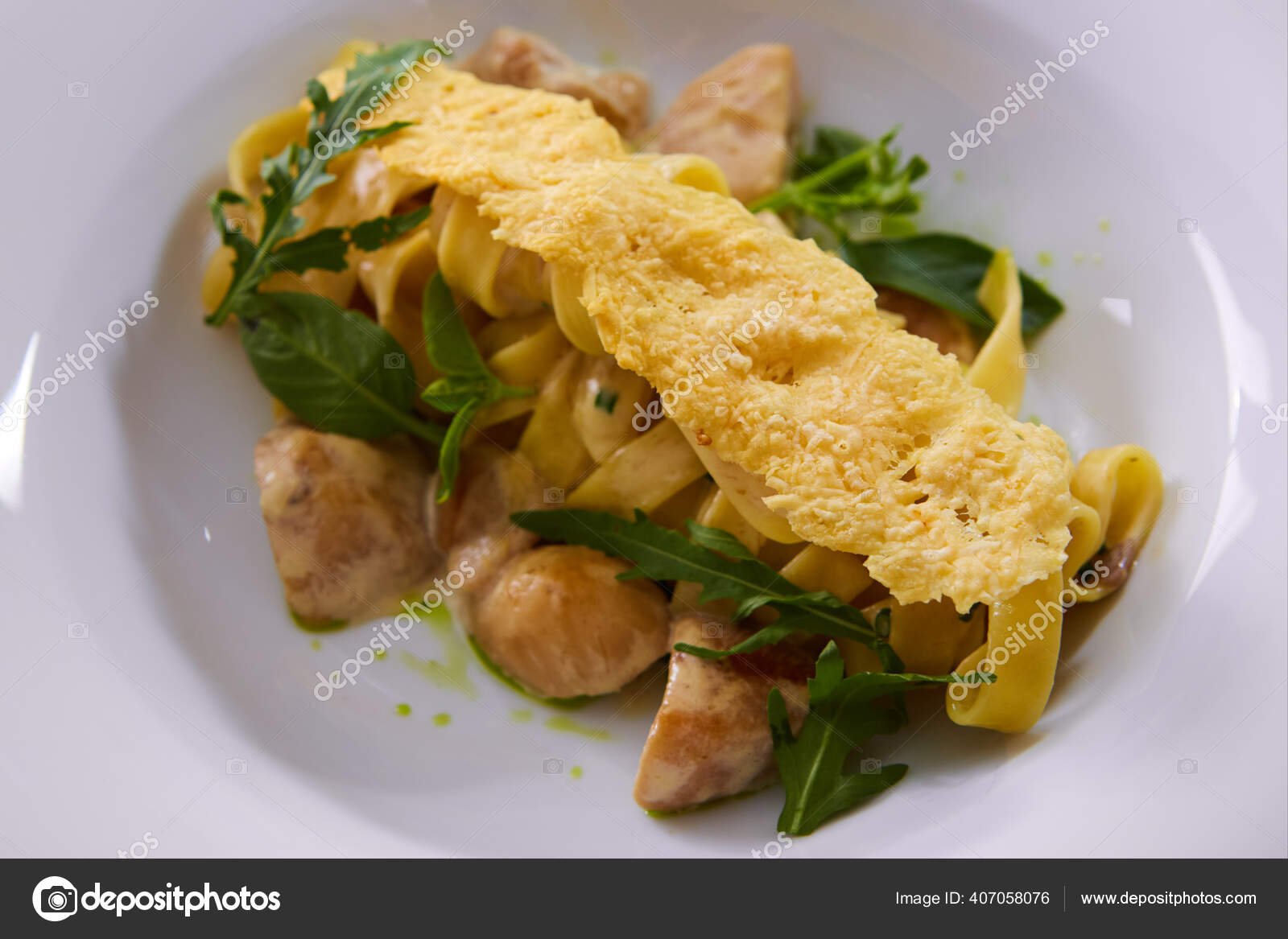 Tagliatelle with Mushroom, Cream Sauce, Truffle and Arugula Stock Photo