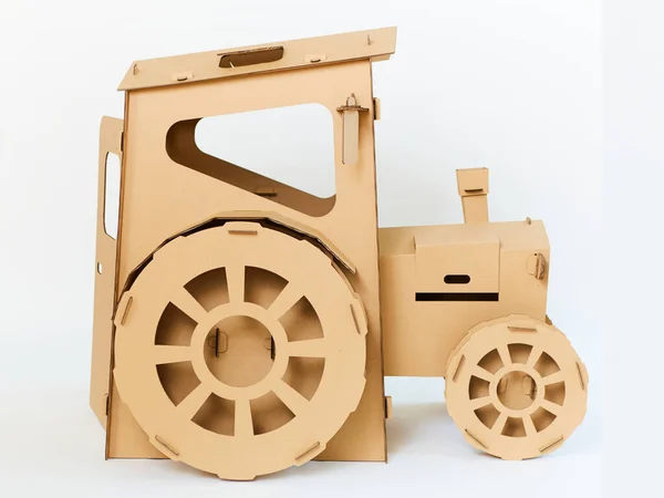 Cardboard tractor on a white background. Agriculture concept. Mockup for design with copy space. — Stock Photo, Image