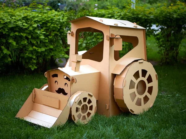 Cardboard tractor on a white background. Agriculture concept. Mockup for design with copy space. — Stock Photo, Image