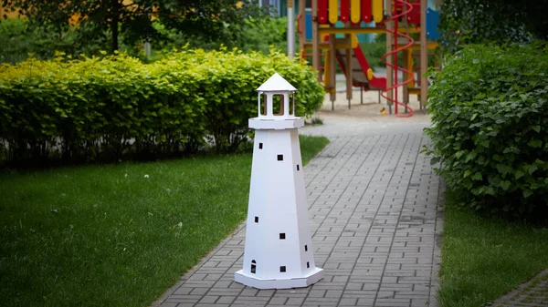 Cardboard Model Building Lighthouse in the garden. — Stock Photo, Image