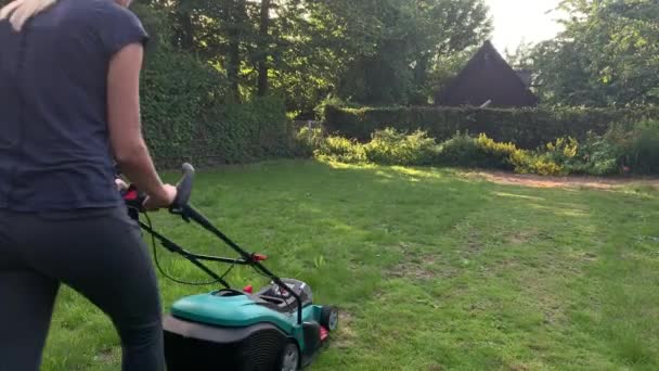 Young Caucasian Woman Mowing Grass Home Garden Beautiful Summer Day — Stock Video