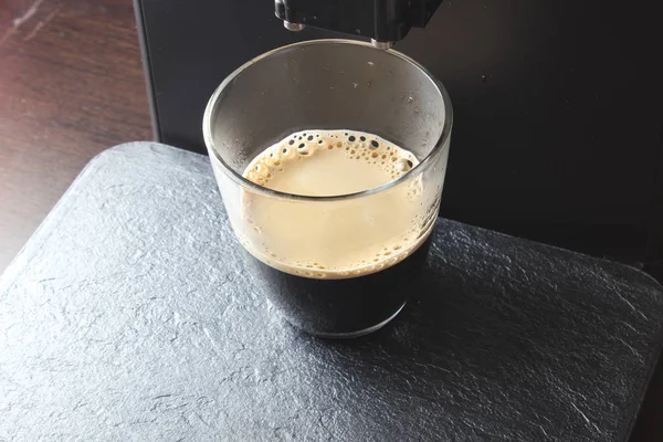 coffee glass on a stone background coffee machine