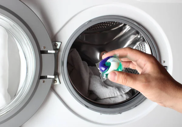 detergent capsule washing machine hand