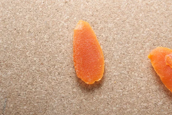 dried mango on a brown background