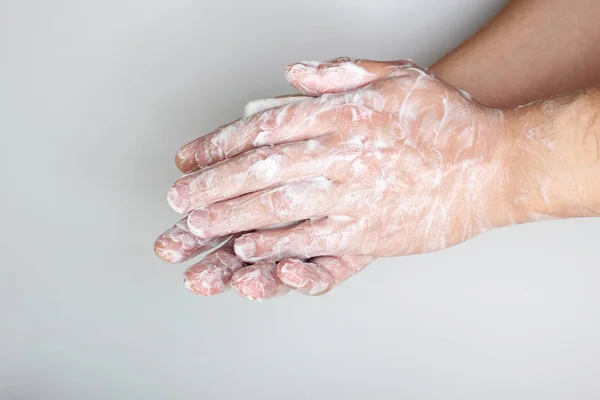 lather hands with soap