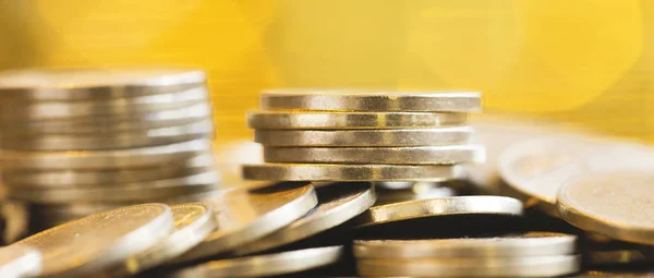 Cash flow management concept - web banner of gold money coins
