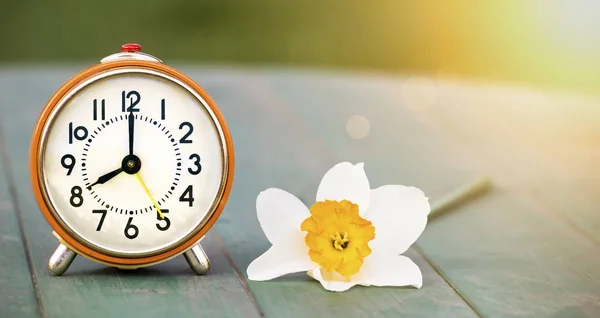 Daylight savings time, spring forward -  alarm clock and easter