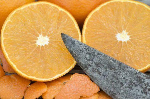 Vitamin c, fresh yellow mandarins with a knife — Stock Photo, Image