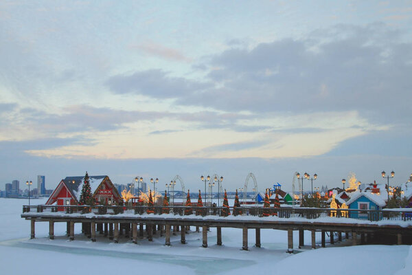 Pier on embankment in winter evening. Kazan, Russia