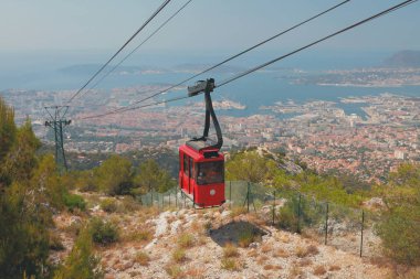Cableway over seaside city. Toulon, France clipart