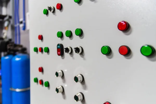 Factory control panel with buttons and signal lamps.