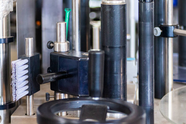 Part of labelling device at modern winery close.