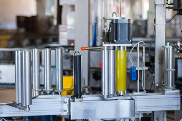 Part of labelling device at modern winery close.