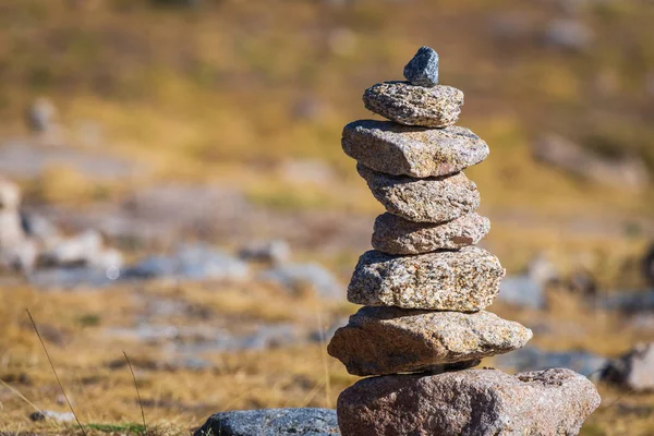 Zen balanced stones stack in high mountains. Scenic mountain view