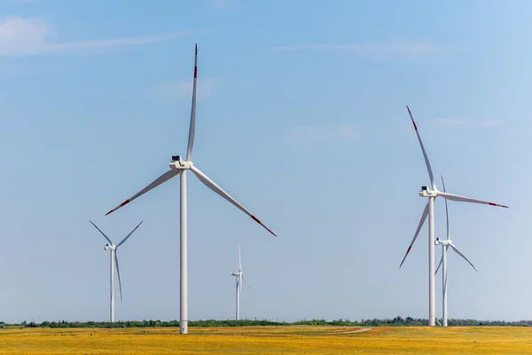 Wind turbine - renewable energy source in a field.