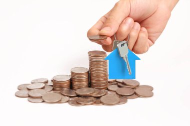 Bir el ve Model ev iş büyüyen para sikke yığını