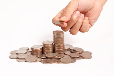 Bir elinde büyüyen para sikke yığını