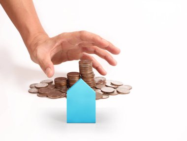 Bir el ve Model ev iş büyüyen para sikke yığını