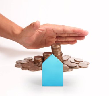 Bir el ve Model ev iş büyüyen para sikke yığını