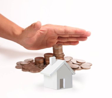 Bir el ve Model ev iş büyüyen para sikke yığını