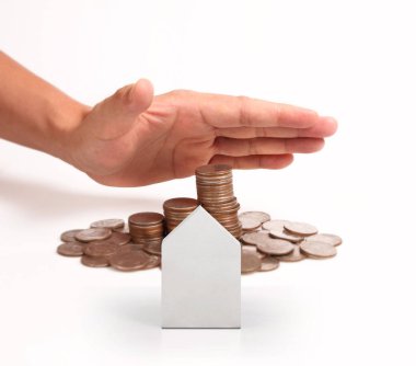 Bir el ve Model ev iş büyüyen para sikke yığını